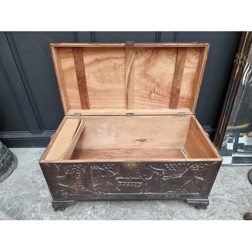 1005 - A Chinese carved camphor wood coffer, 106.5cm wide.