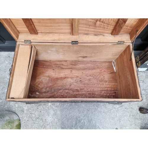 1005 - A Chinese carved camphor wood coffer, 106.5cm wide.