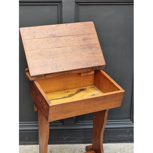 1009 - An old pitch pine school desk, 55.5cm wide.