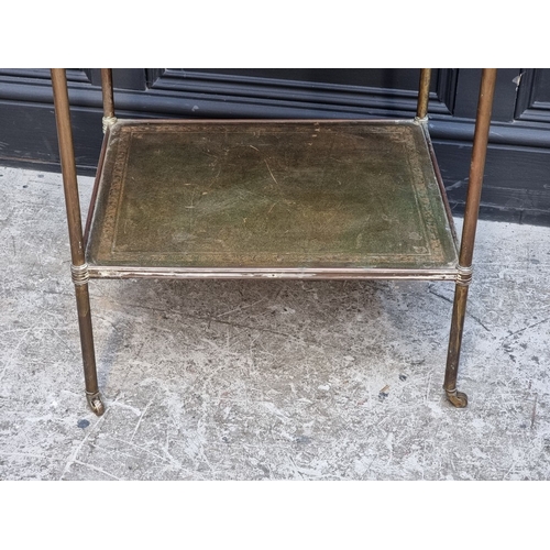 1011 - A vintage brass and gilt tooled green leather two-tier occasional table, 58cm high x 48cm wide.... 