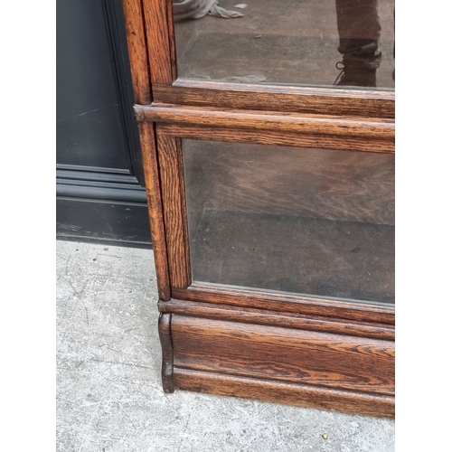 1015 - A Globe-Wernicke oak four-tier sectional bookcase, 86.5cm wide.