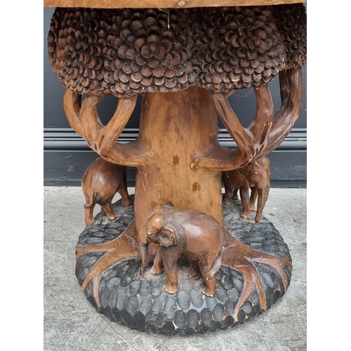 1016 - An Indian carved hardwood pedestal table, 78cm diameter.