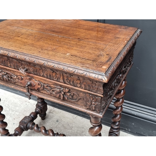 1021 - An early 20th century Continental carved oak occasional table, with hinged top and frieze drawer, 56... 