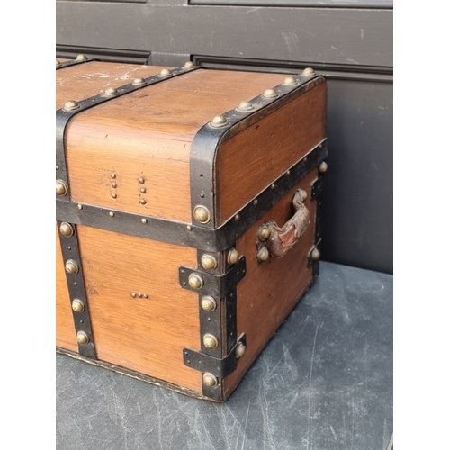 1027 - An old pine, metal bound and brass studded trunk, 41cm high x 71cm wide.