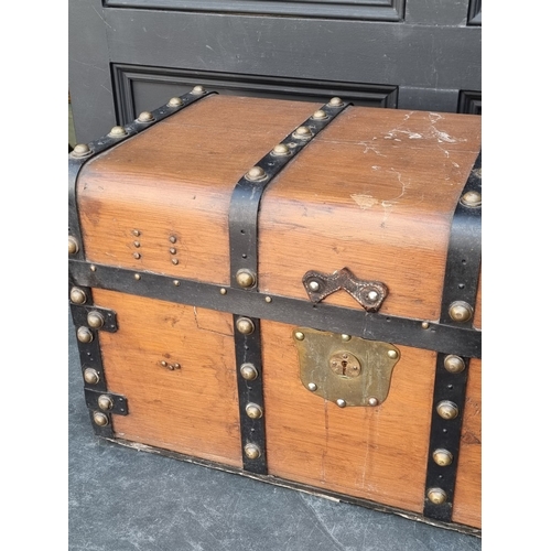 1027 - An old pine, metal bound and brass studded trunk, 41cm high x 71cm wide.