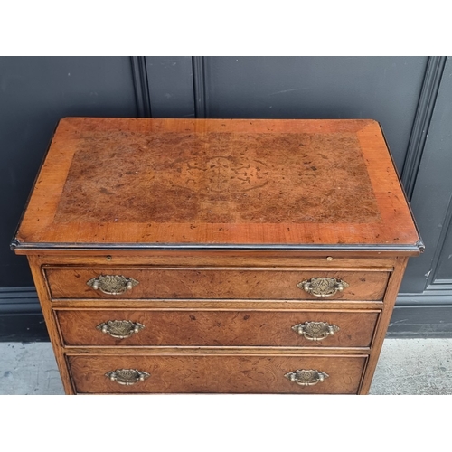 1029 - A small reproduction burr oak chest of drawers, with brushing slide, 66cm wide.