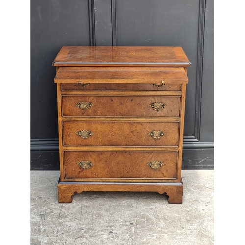 1029 - A small reproduction burr oak chest of drawers, with brushing slide, 66cm wide.