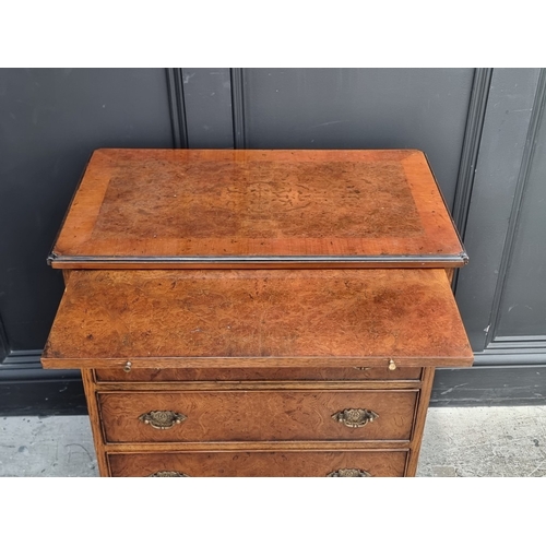 1029 - A small reproduction burr oak chest of drawers, with brushing slide, 66cm wide.