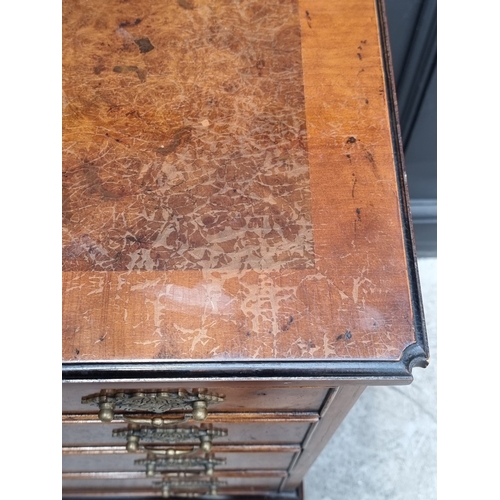 1029 - A small reproduction burr oak chest of drawers, with brushing slide, 66cm wide.