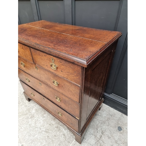 1032 - A George III oak chest of drawers, 95cm wide.