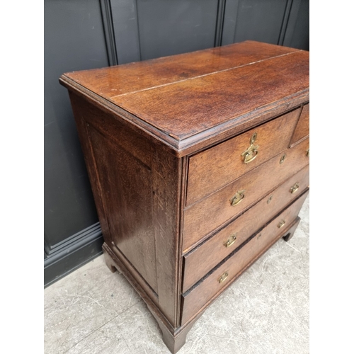 1032 - A George III oak chest of drawers, 95cm wide.