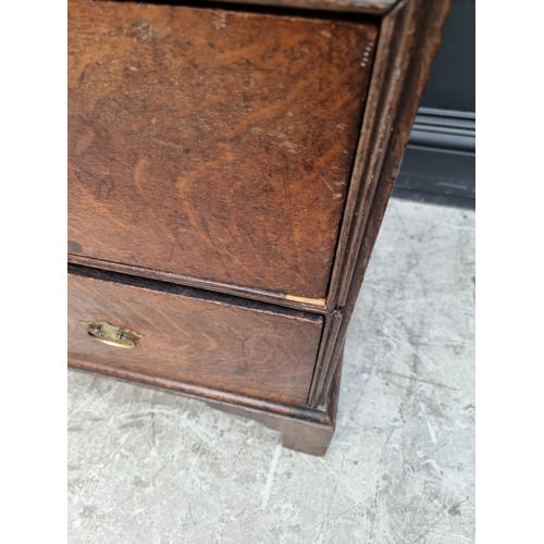 1032 - A George III oak chest of drawers, 95cm wide.