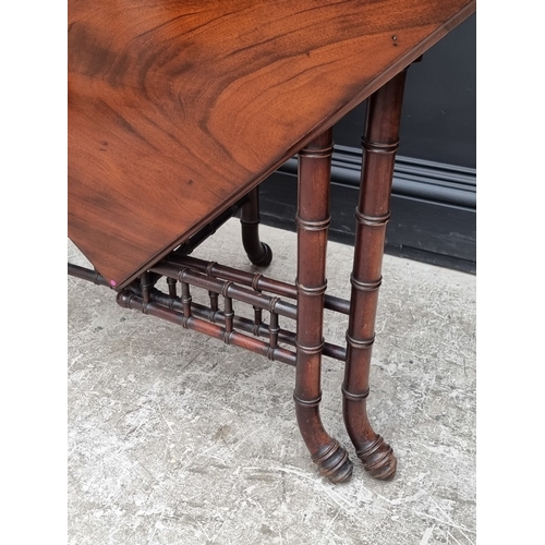 1033 - An unusual reproduction mahogany simulated bamboo drop-leaf table, 97cm wide.