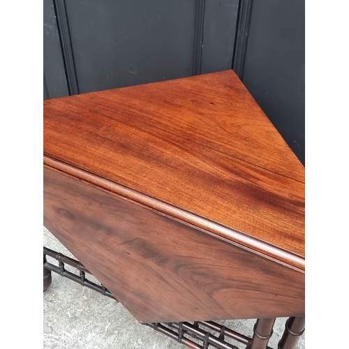 1033 - An unusual reproduction mahogany simulated bamboo drop-leaf table, 97cm wide.