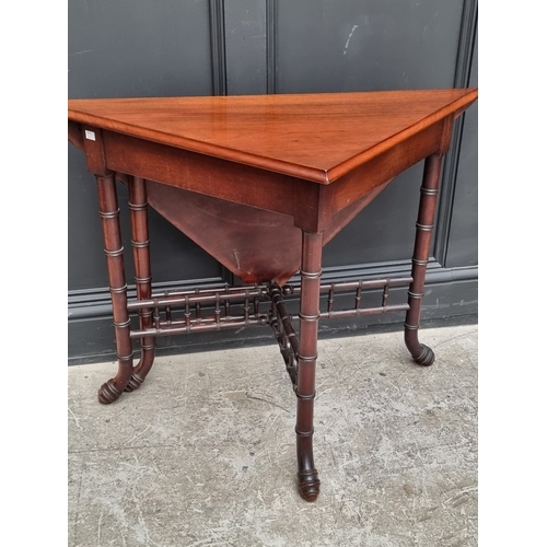 1033 - An unusual reproduction mahogany simulated bamboo drop-leaf table, 97cm wide.