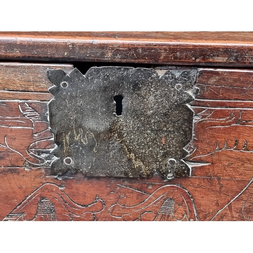 1034 - A small 17th century and later carved cedar and pine coffer, 77.5cm wide, (extensive alterations).... 