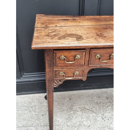 1035 - An 18th century oak and walnut crossbanded lowboy, 83.5cm wide.
