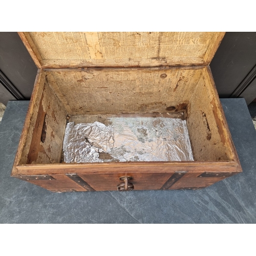 1036 - An antique teak and steel bound chest, 36cm high x 59cm wide x 36cm deep.
