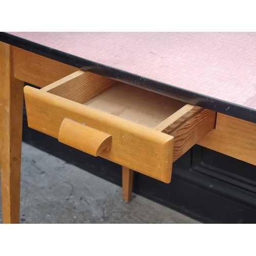 1037 - A 1950s melamine top kitchen table, with frieze drawer, 90cm wide.