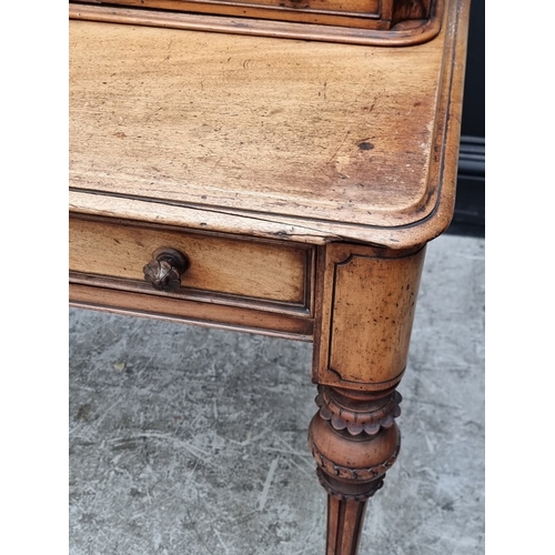1038 - A Victorian mahogany side table, stamped 'Wilkinson', 122cm wide.