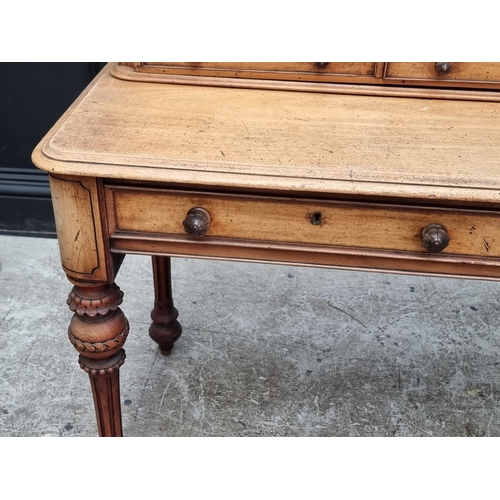 1038 - A Victorian mahogany side table, stamped 'Wilkinson', 122cm wide.