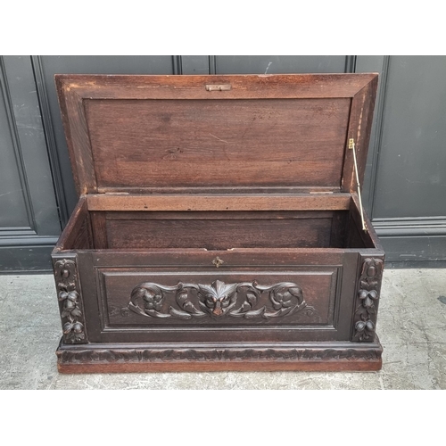 1039 - A late Victorian carved oak 'Green Man' coffer, 99cm wide.
