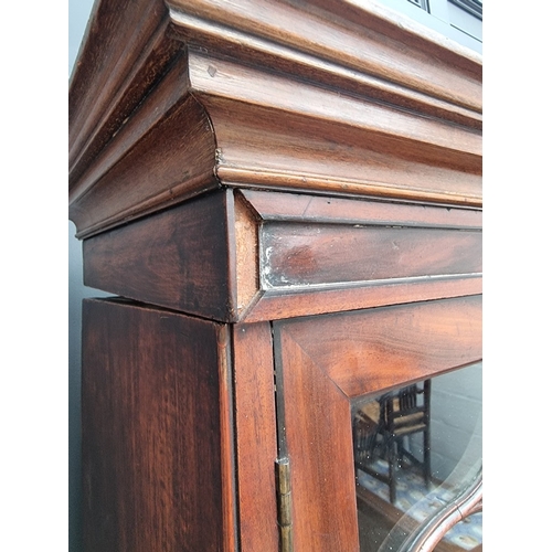 1051 - A large early 19th century mahogany and ebony strung breakfront bookcase, 195cm wide.... 