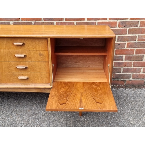 1052 - A mid-century G-Plan teak sideboard, 205.5cm wide.