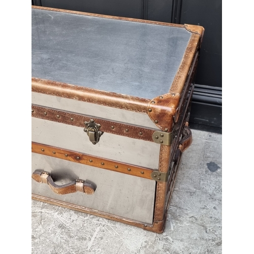 1078 - A reproduction polished aluminium and leather steamer trunk, from Feather & Black, 51cm high x 1... 