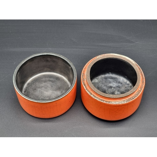 1332 - Studio Pottery: a George Jouve orange glazed box and cover, 10cm high.