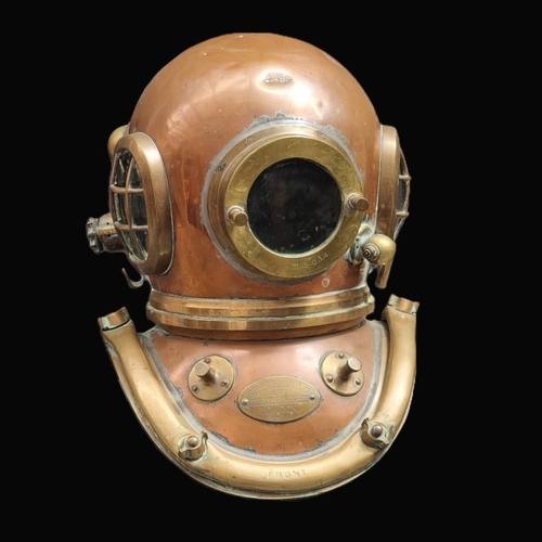 A Siebe Gorman & Co copper and brass six bolt diver's helmet, labelled and numbered AP7985.