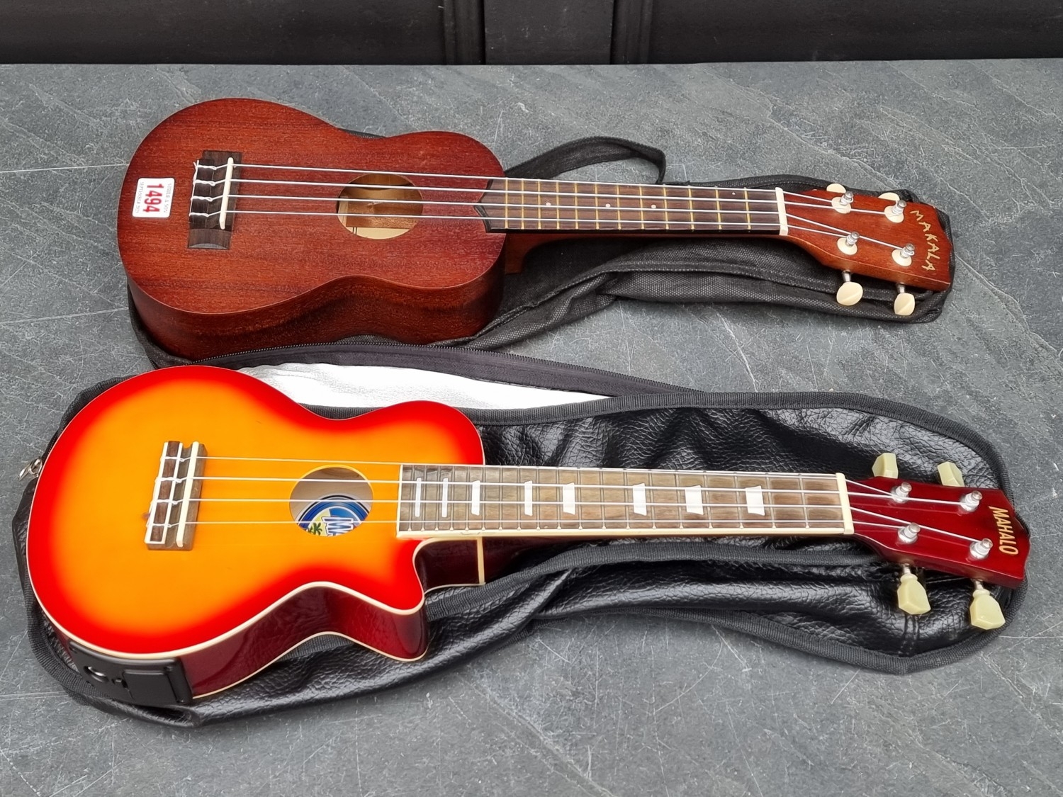 Two Ukuleles, comprising a Makala MK-S example; and a Mahalo example ...