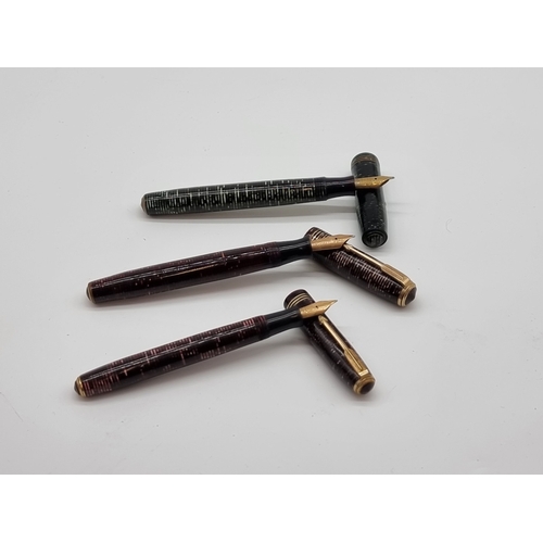 Three 1930s Parker Duofold fountain pens, the black example inscribed ...