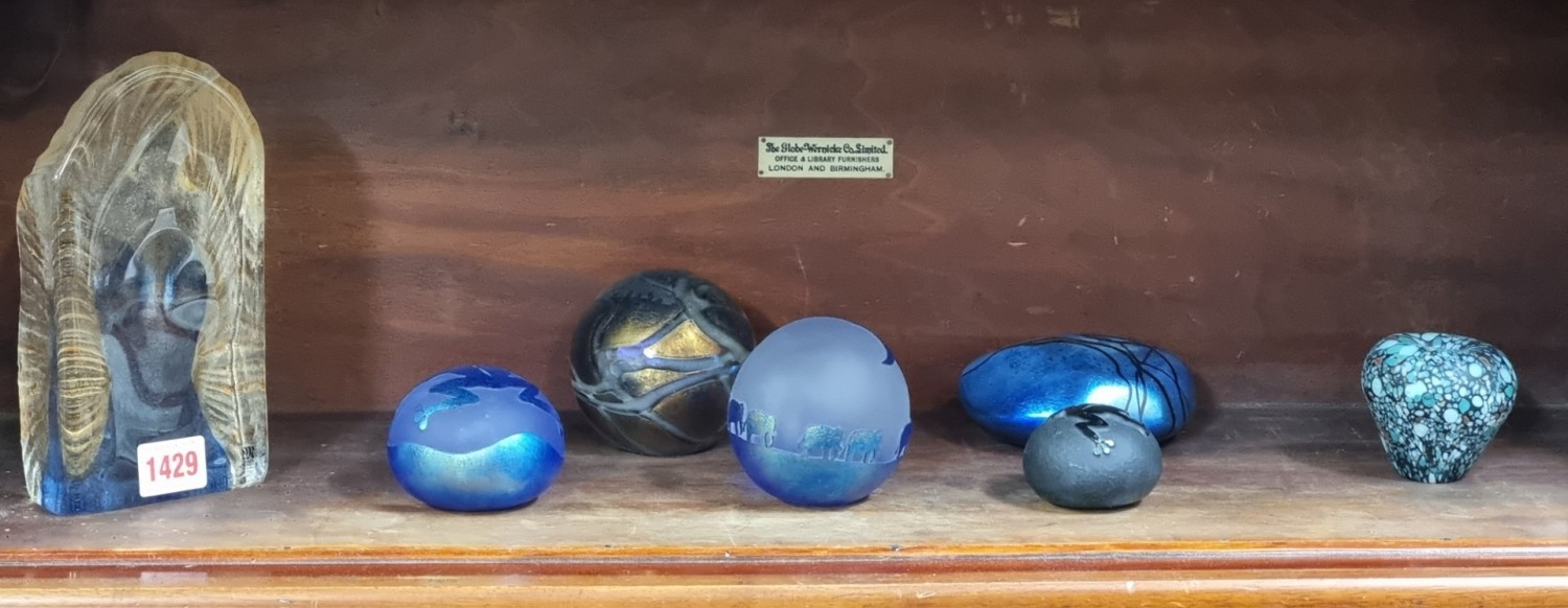 An interesting collection of glass paperweights, to include an intaglio ...