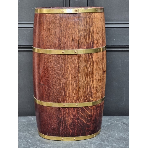 1016 - A coopered oak and brass bound stick stand, 61cm high.
