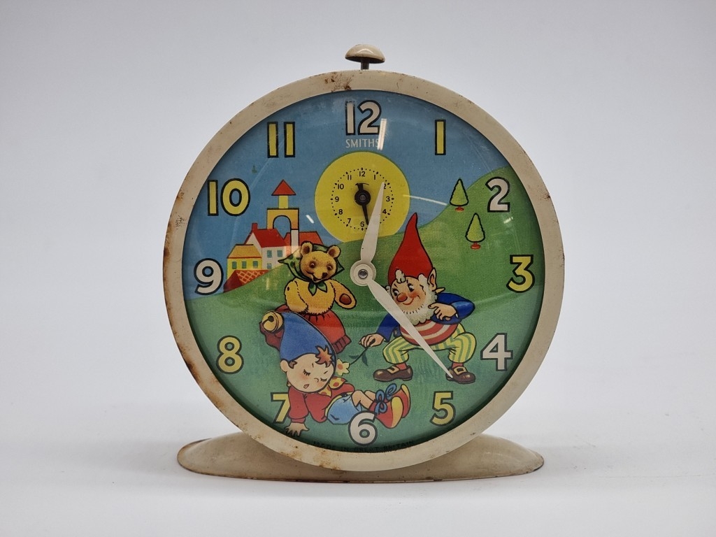 A 1950s Smiths 'Noddy' alarm clock, 12.5cm high.