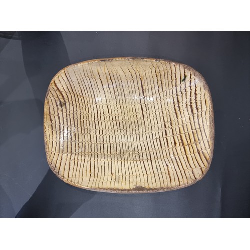 1314 - A good and large antique slipware dish, possibly Isleworth, with combed decoration, 52cm wide.... 