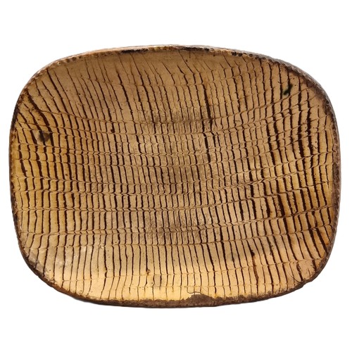 1314 - A good and large antique slipware dish, possibly Isleworth, with combed decoration, 52cm wide.... 
