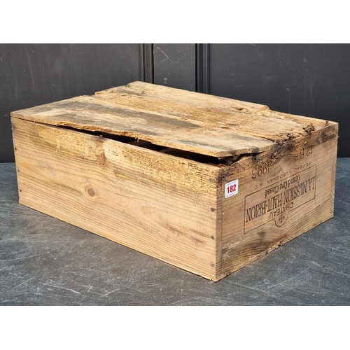 149 - A case of twelve 75cl bottles of Chateau La Mission Haut-Brion, 1995, in owc, (case distressed). (12... 
