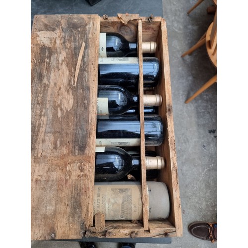 149 - A case of twelve 75cl bottles of Chateau La Mission Haut-Brion, 1995, in owc, (case distressed). (12... 