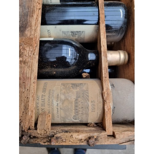 149 - A case of twelve 75cl bottles of Chateau La Mission Haut-Brion, 1995, in owc, (case distressed). (12... 