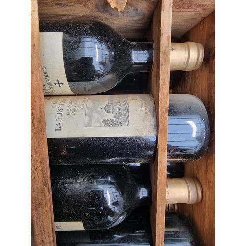 149 - A case of twelve 75cl bottles of Chateau La Mission Haut-Brion, 1995, in owc, (case distressed). (12... 