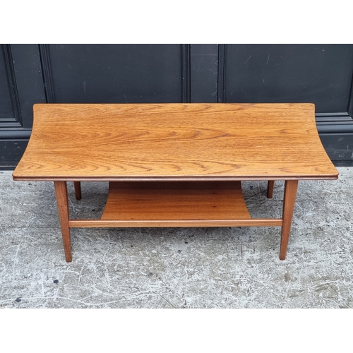 1034 - A mid-century teak coffee table, with shaped ends, 91cm wide.