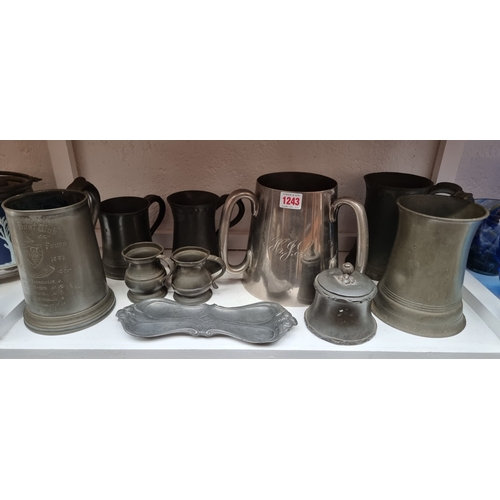 1243 - A collection of antique pewter; together with a plated tyg, 18cm high. (10)