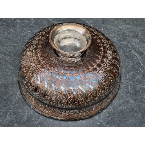 1307 - A large Persian electroplated pedestal bowl, inscribed with Islamic script, 34.5cm diameter.... 
