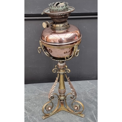 1352 - An Arts & Crafts copper and brass oil lamp, total height 49cm, (reservoir associated).... 