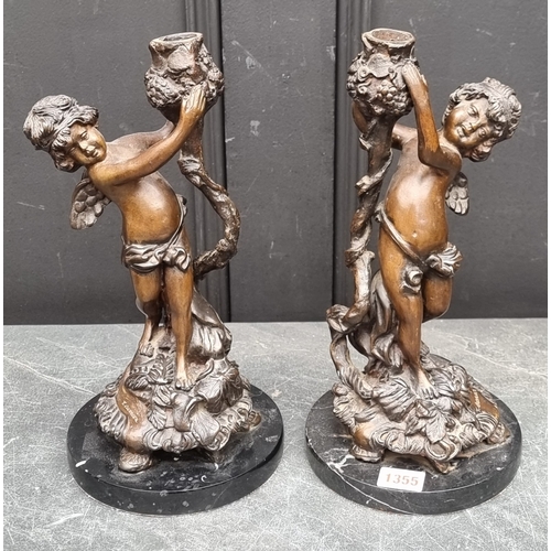 1355 - A pair of Art Nouveau style bronze figural candlesticks, indistinctly signed, on marble bases, 31cm ... 
