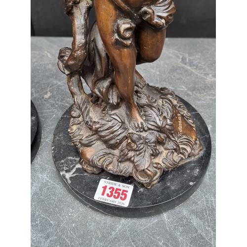 1355 - A pair of Art Nouveau style bronze figural candlesticks, indistinctly signed, on marble bases, 31cm ... 
