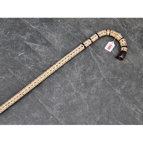 1400 - A novelty vertebrae and horn walking stick.