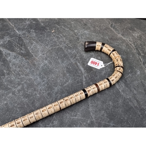 1400 - A novelty vertebrae and horn walking stick.